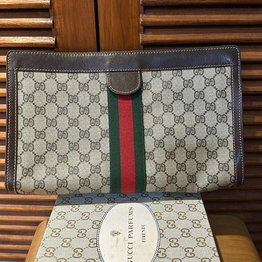 GUCCI - clutch in coated canvas